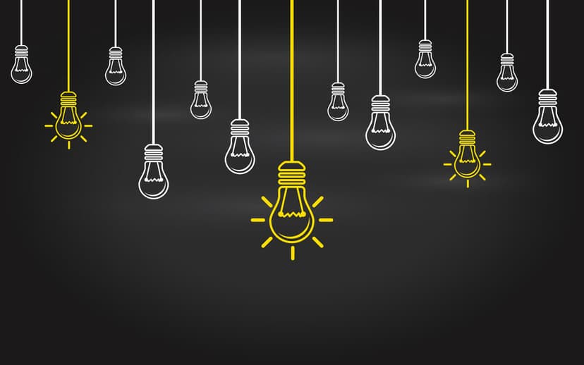Light bulbs on a blackboard background.